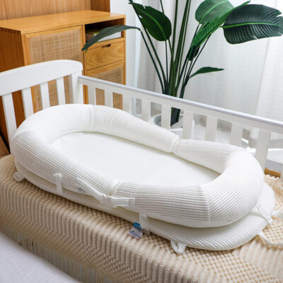 Cozy and Secure Baby Nest Bed - Soft and Adjustable for a Perfect Sleep