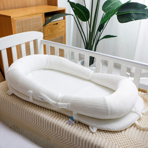 Cozy and Secure Baby Nest Bed - Soft and Adjustable for a Perfect Sleep